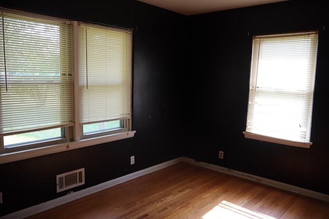 empty room with light hardwood / wood-style floors