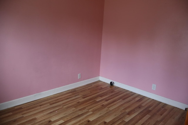 unfurnished room featuring wood-type flooring