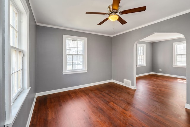 spare room with ornamental molding, ceiling fan, and dark hardwood / wood-style flooring