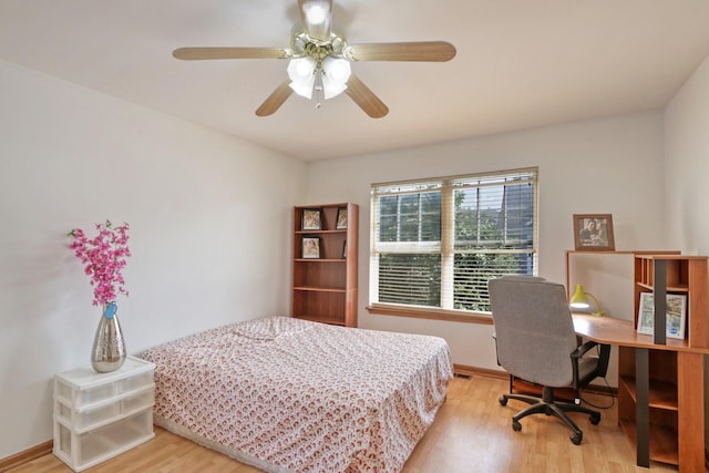 bedroom with light wood-type flooring and ceiling fan