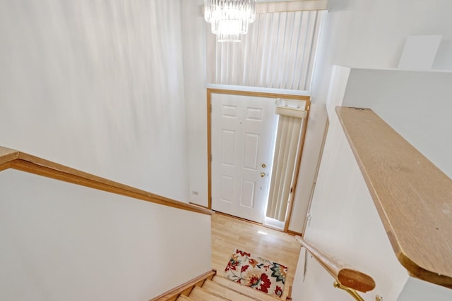 entryway featuring a notable chandelier and hardwood / wood-style floors