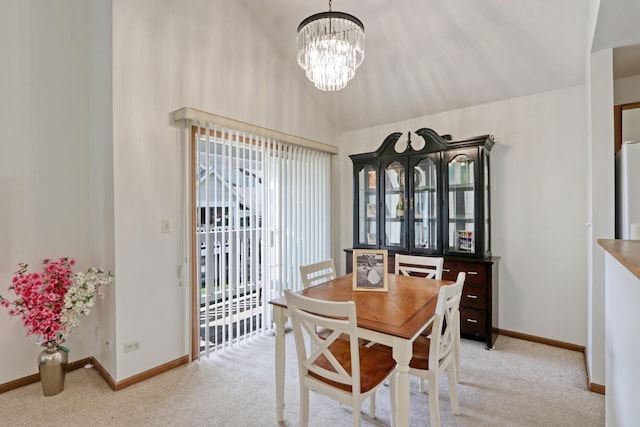 carpeted dining room featuring lofted ceiling and a notable chandelier