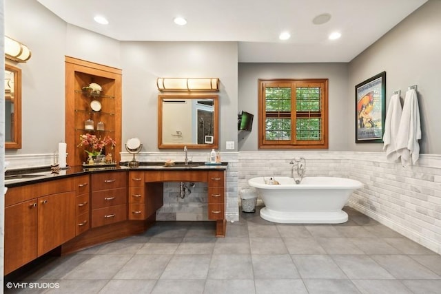 bathroom featuring a bathing tub and vanity