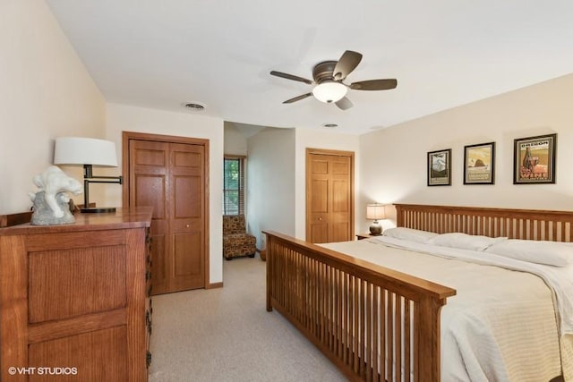 bedroom with light carpet and ceiling fan