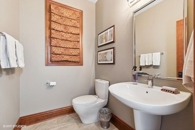 bathroom with sink and toilet