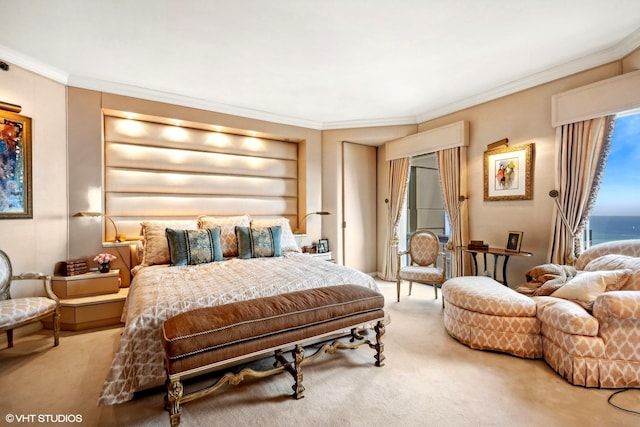 bedroom with a water view, carpet floors, and crown molding