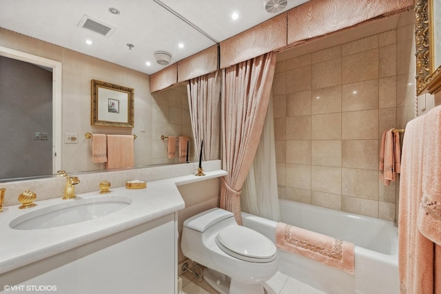 full bathroom featuring tile patterned floors, vanity, toilet, and shower / bathtub combination with curtain