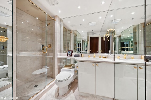 bathroom featuring vanity, toilet, and walk in shower