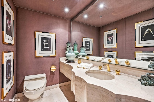 bathroom with tile patterned floors, vanity, and toilet