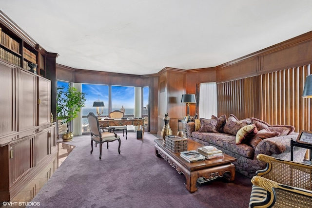 living room featuring carpet flooring and wooden walls