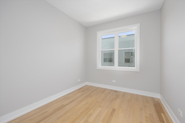 spare room featuring light hardwood / wood-style flooring