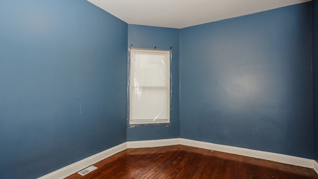 unfurnished room featuring wood-type flooring