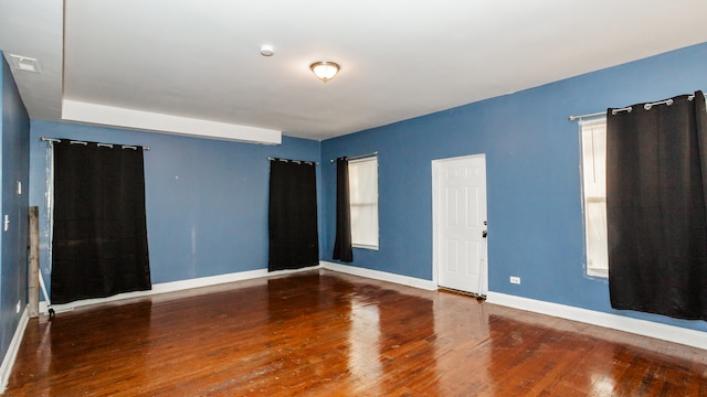 spare room featuring hardwood / wood-style flooring