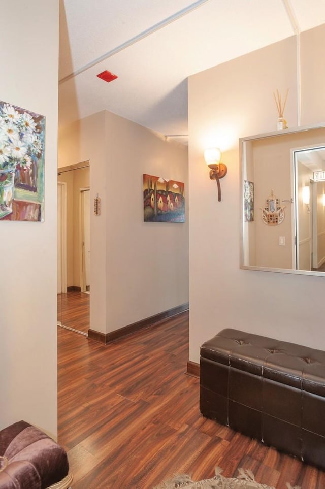 hallway with dark wood-type flooring