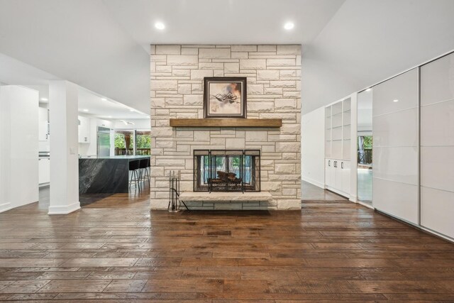 unfurnished living room with a fireplace and wood-type flooring