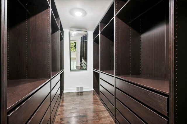 spacious closet featuring hardwood / wood-style floors