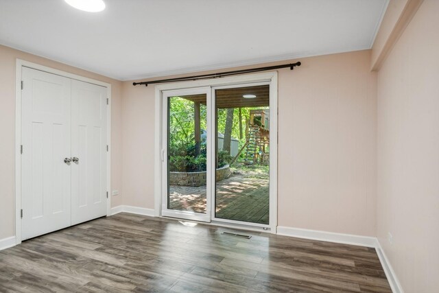 spare room with hardwood / wood-style floors