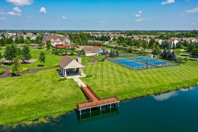 birds eye view of property with a water view and a residential view