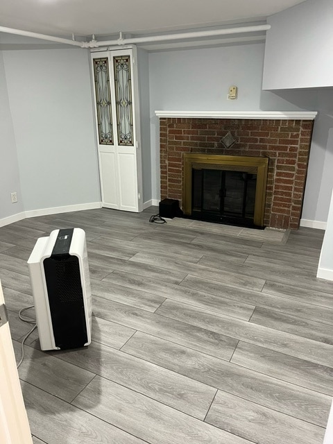 living room featuring a fireplace and hardwood / wood-style floors