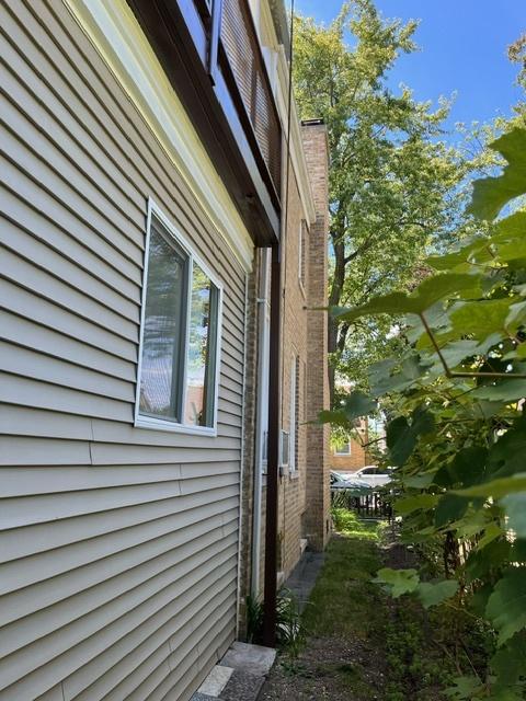 view of home's exterior featuring a chimney