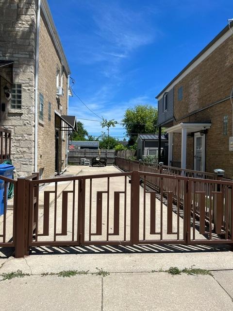 view of gate featuring fence