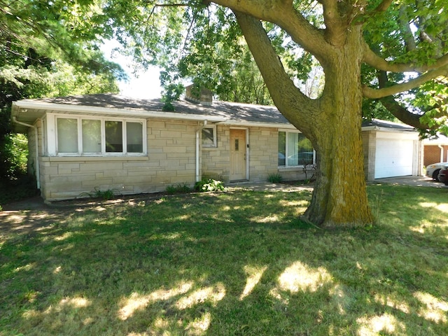 single story home featuring a front yard and a garage