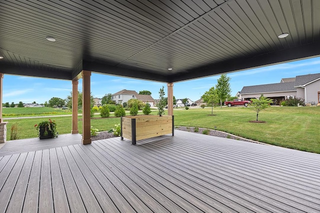 wooden terrace with a yard