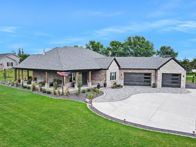 view of front of property with a shingled roof, an attached garage, driveway, and a front lawn