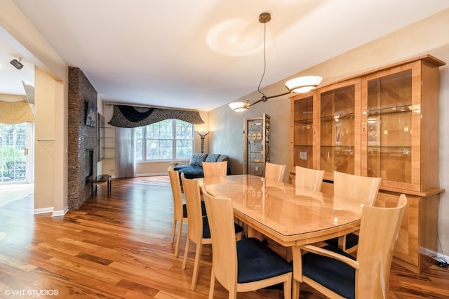 dining area with hardwood / wood-style flooring and plenty of natural light