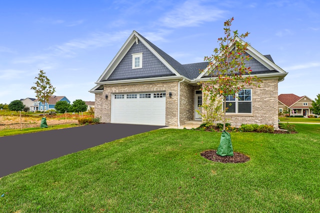 craftsman-style house with a garage and a front yard