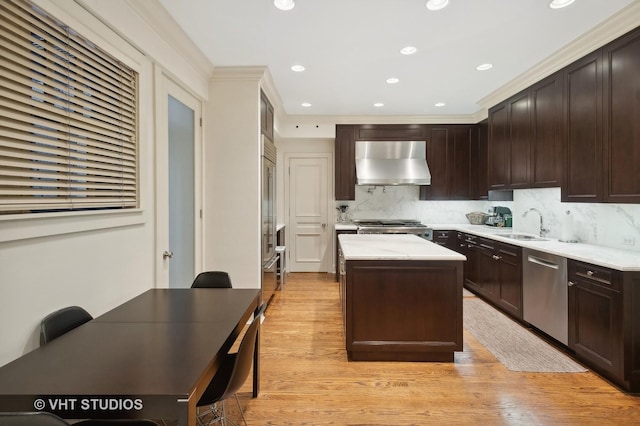 kitchen with a kitchen island, wall chimney range hood, tasteful backsplash, stainless steel dishwasher, and stove