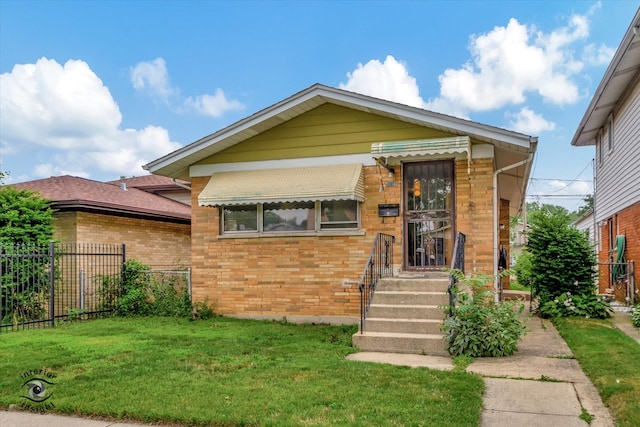 view of front of home with a front yard