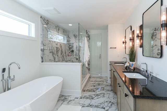 bathroom featuring independent shower and bath, dual vanity, and tile patterned flooring