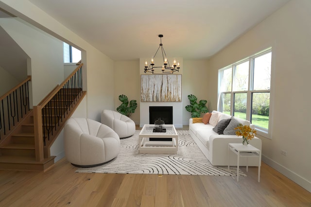 living room featuring a chandelier and hardwood / wood-style flooring