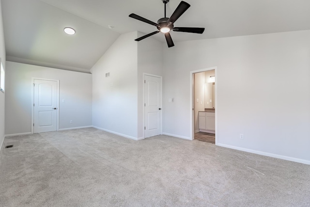 unfurnished bedroom with light carpet, connected bathroom, visible vents, and baseboards