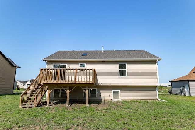 rear view of house featuring stairs, a yard, a deck, and a shingled roof