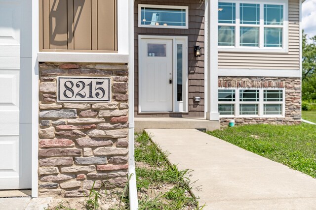 rear view of property featuring a wooden deck, central air condition unit, and a lawn