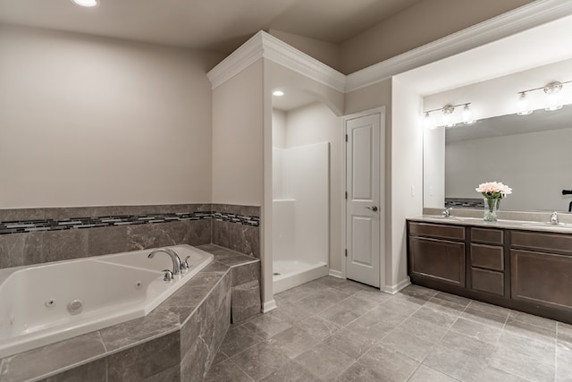 bathroom featuring double vanity, a tub with jets, a walk in shower, and a sink