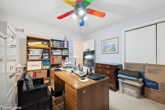 office area featuring light carpet and ceiling fan