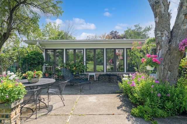 view of patio / terrace with a sunroom