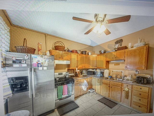 kitchen with light tile patterned flooring, sink, appliances with stainless steel finishes, and ceiling fan