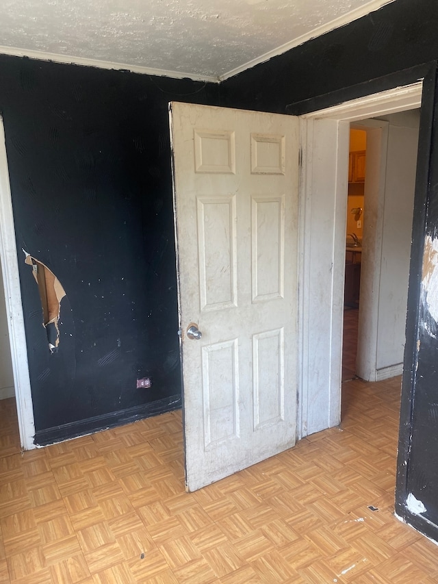 interior space with stacked washer / dryer, sink, and tile walls