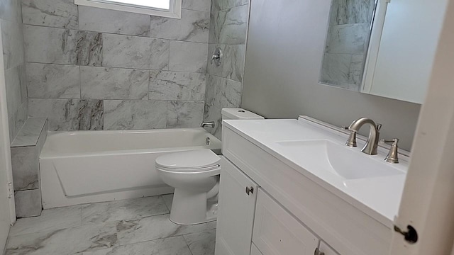 full bathroom with toilet, vanity, and tiled shower / bath