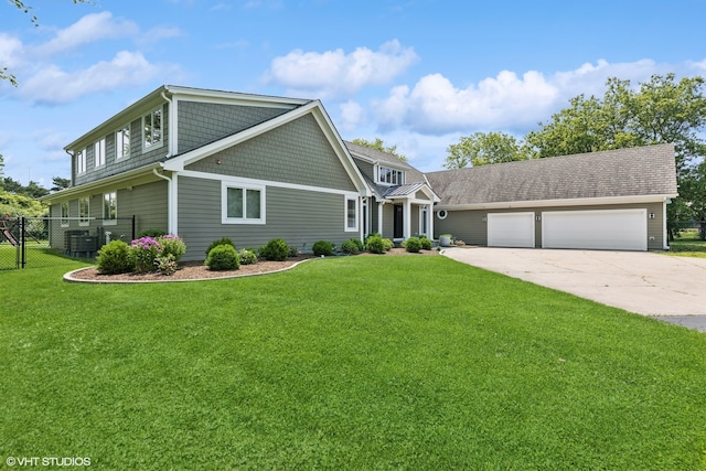 view of front facade featuring a garage, a front lawn, and central air condition unit