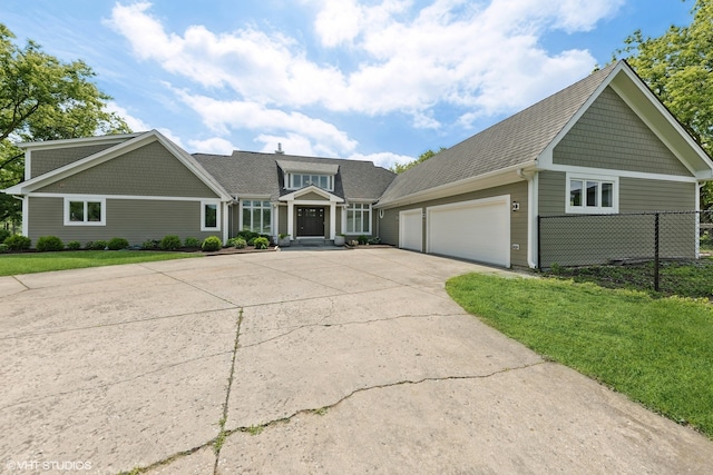 view of front facade with a front lawn and a garage