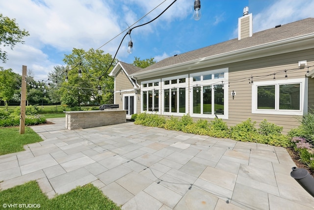 rear view of house with a patio area