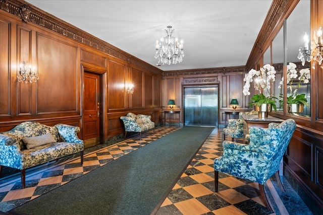 sitting room with ornamental molding, elevator, and a notable chandelier