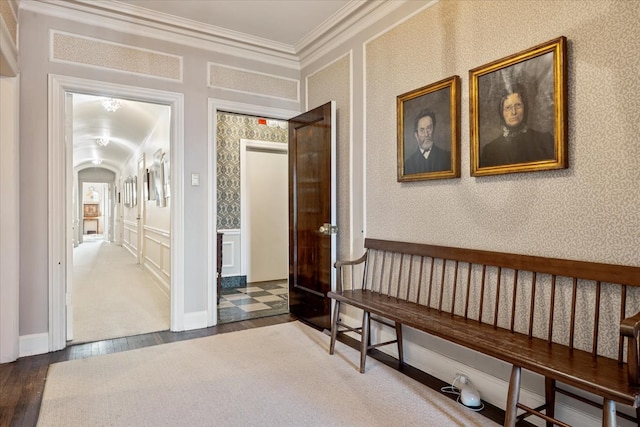 hall featuring wood-type flooring and crown molding