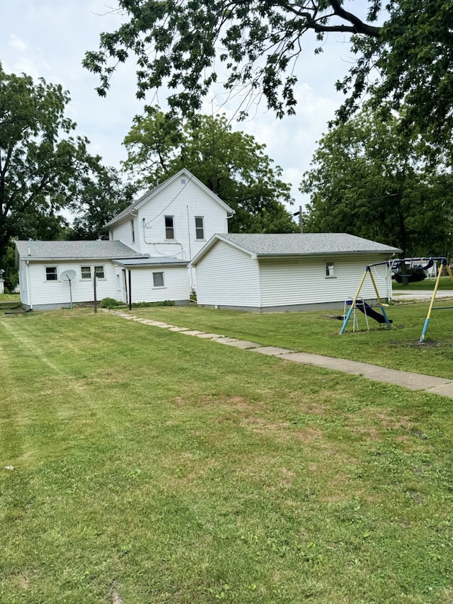 exterior space featuring a lawn and a playground