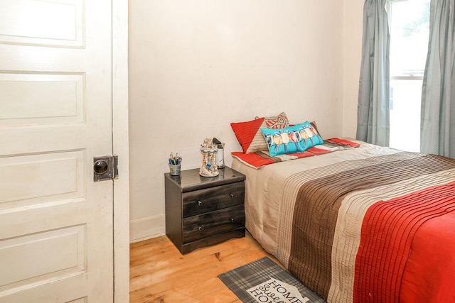 bedroom with light hardwood / wood-style flooring